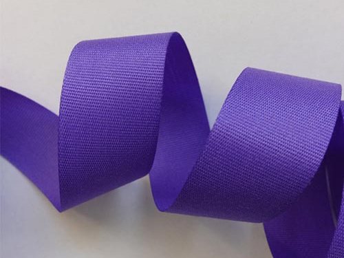 Purple gross grain ribbon curled to show both faces