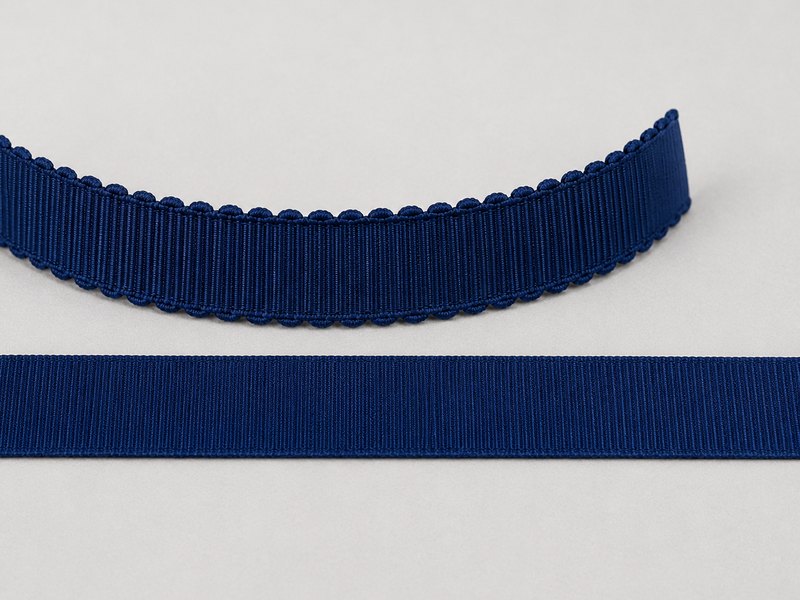 Navy petersham curved into an arc above a flat length of grosgrain