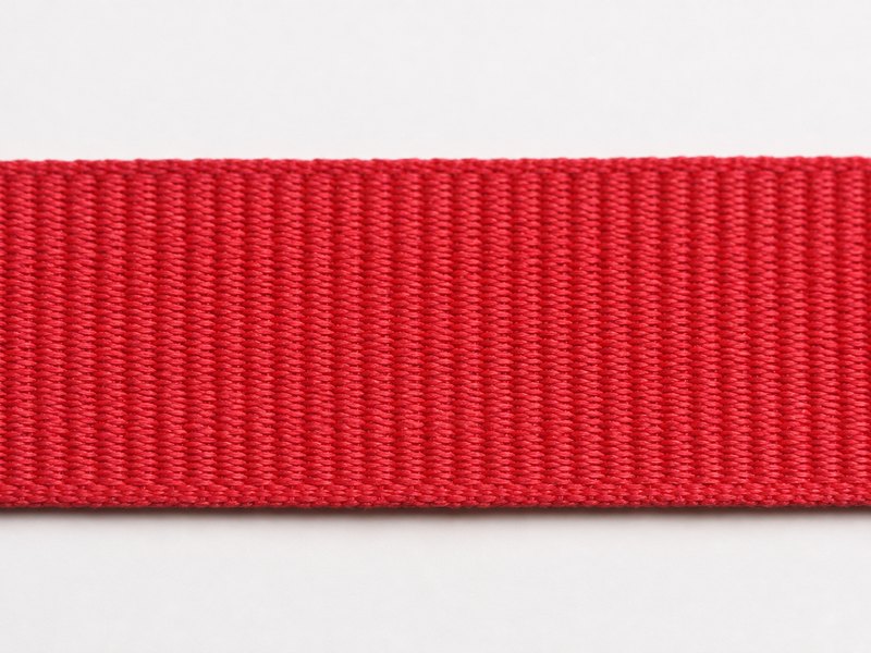 Close-up of red grosgrain ribbon showing the ribs across it